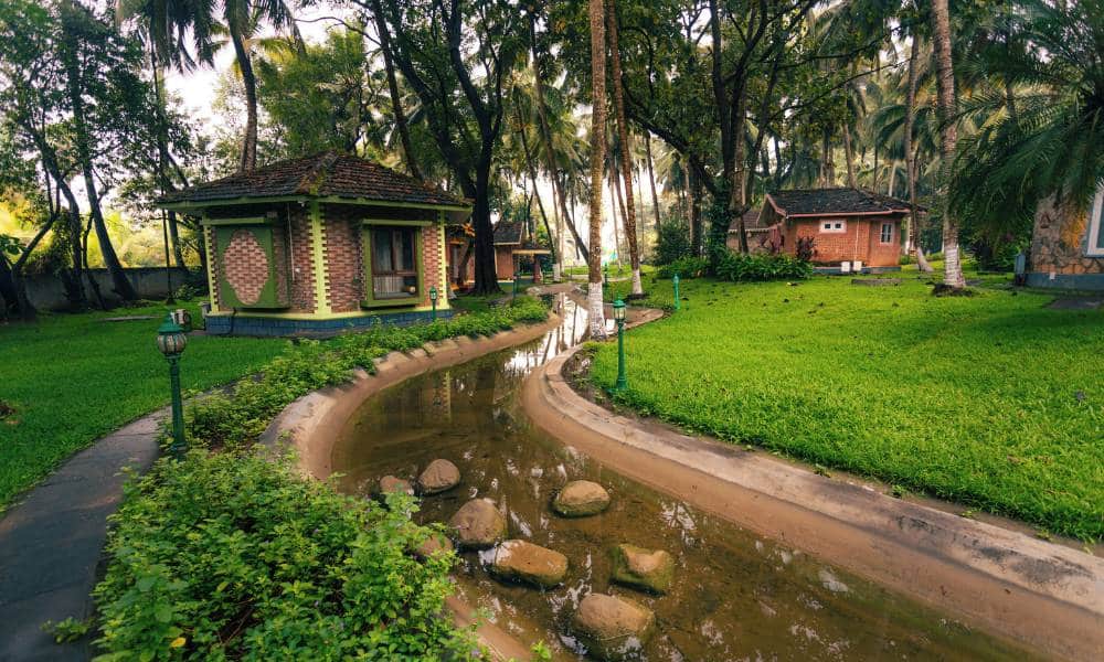 Traditional Vastu-designed villas at Kairali Ayurvedic Healing Village, one of the top Ayurveda Retreats in Kerala.